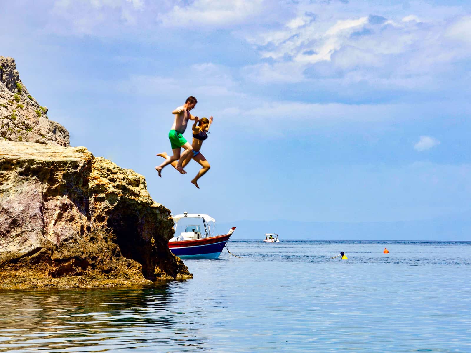 jumping off rock taormina - travel guide sicily east coast