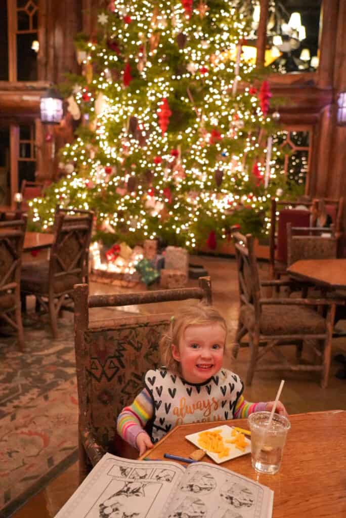 toddler eating dinner at whiteface lodge - winter weekend in Lake Placid