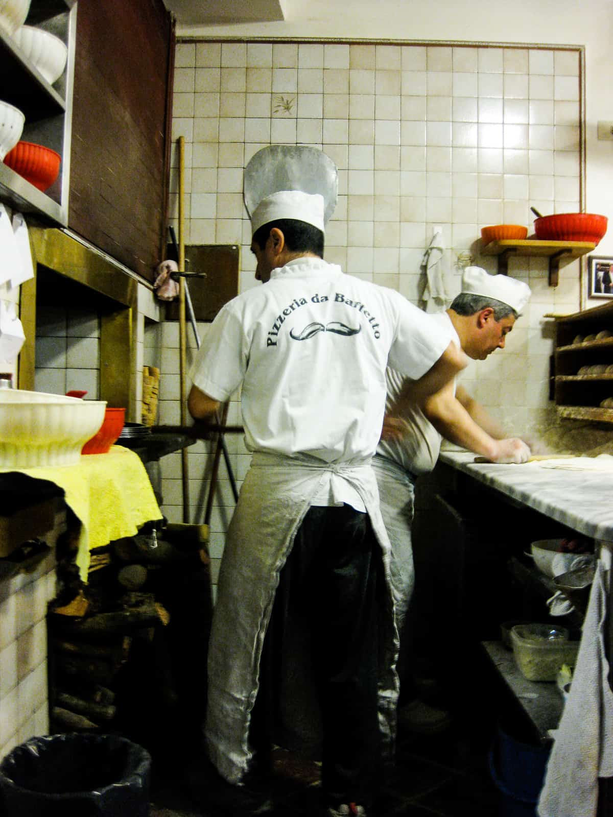 men making pizza at pizzeria da baffetto Rome Italy