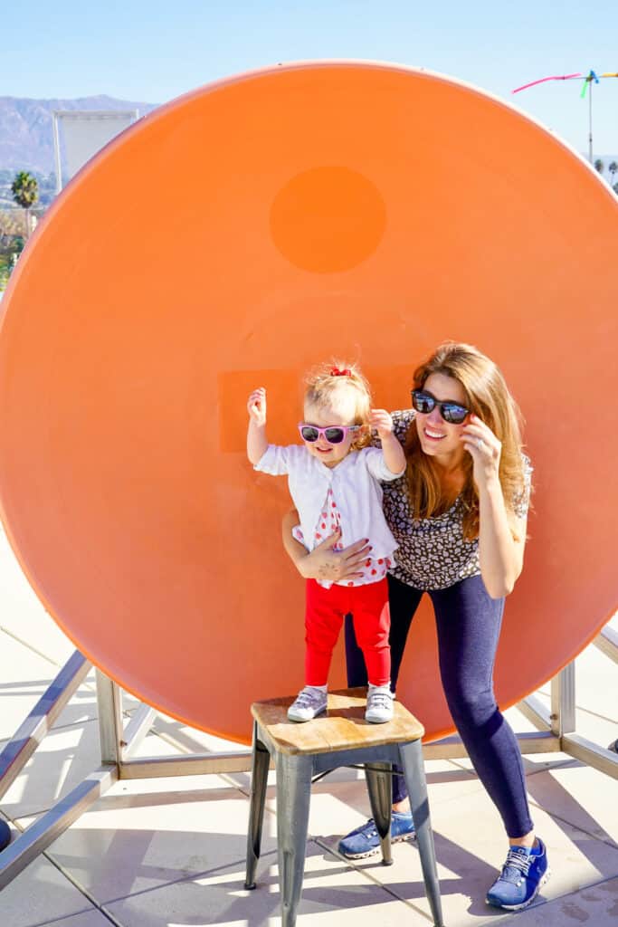 mom and daughter in front of giant drum - family road trip highway 1