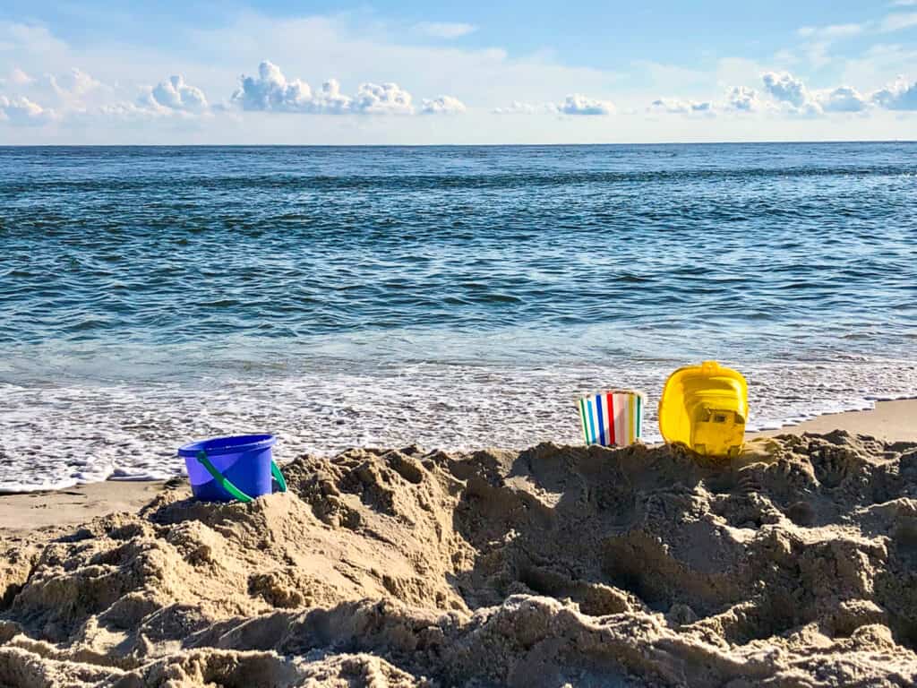 sand toys on the beach in cape may- Compass Roam travel blog