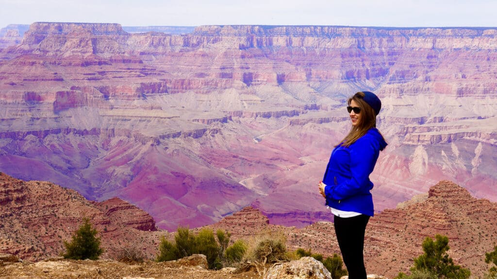 girl standing next to Grand Canyon - epic Arizona family road trip