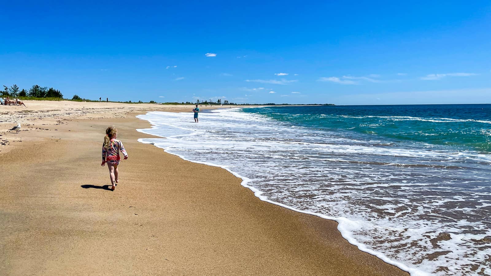 girl walking on beach - luxury Rhode Island family resort Weekapaug Inn