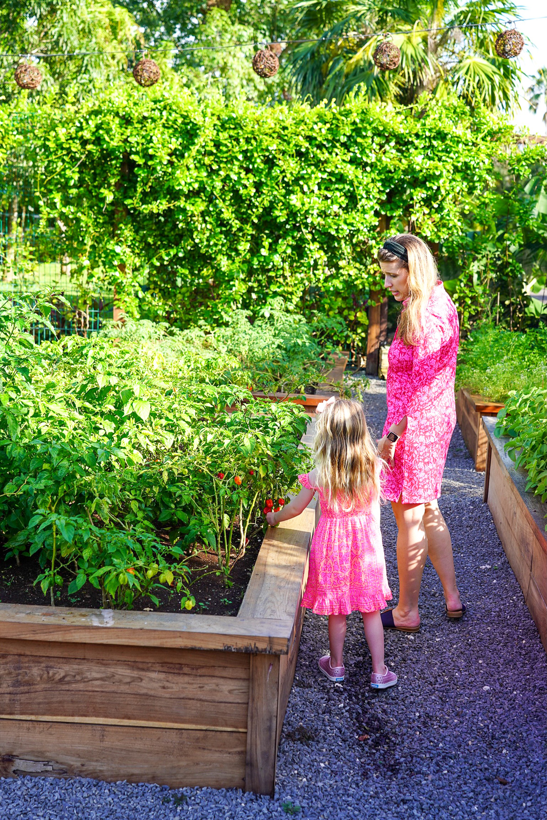 mom and daughter in la ceiba garden - rosewood mayakoba luxury family resort