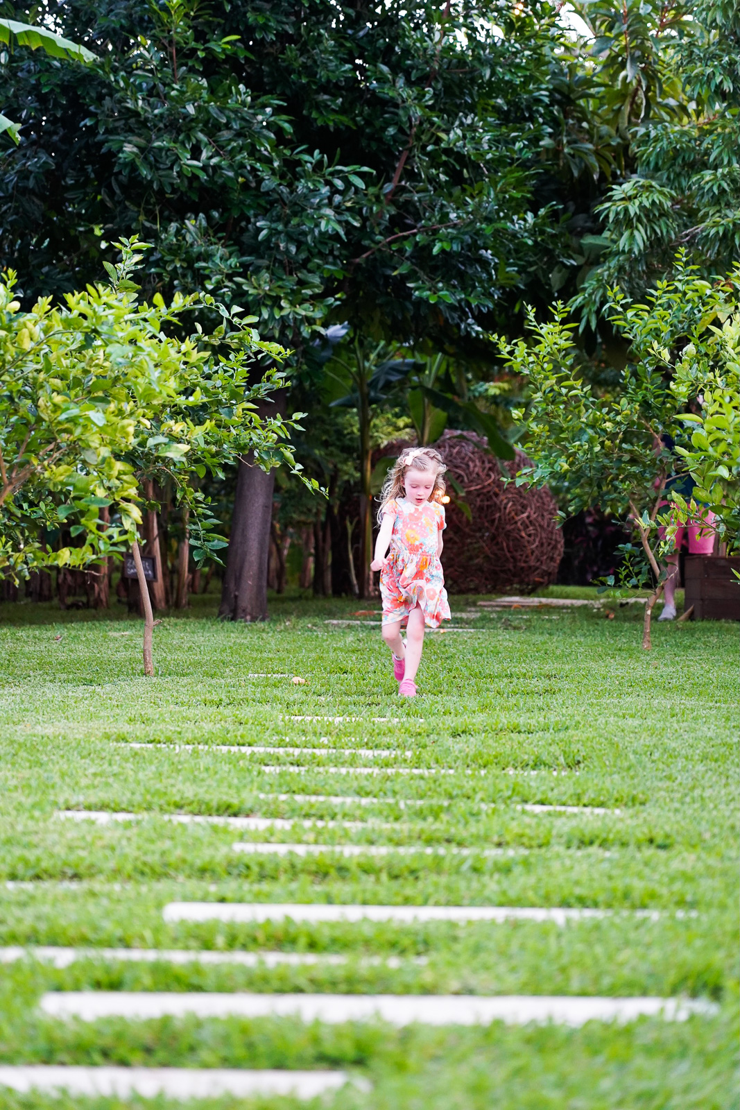 girl running in la ceiba garden