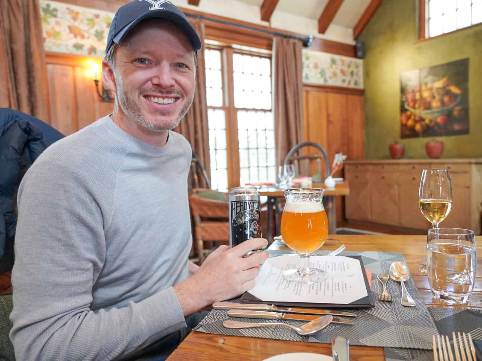 man drinking heady topper beer - romantic Vermont getaway twin farms