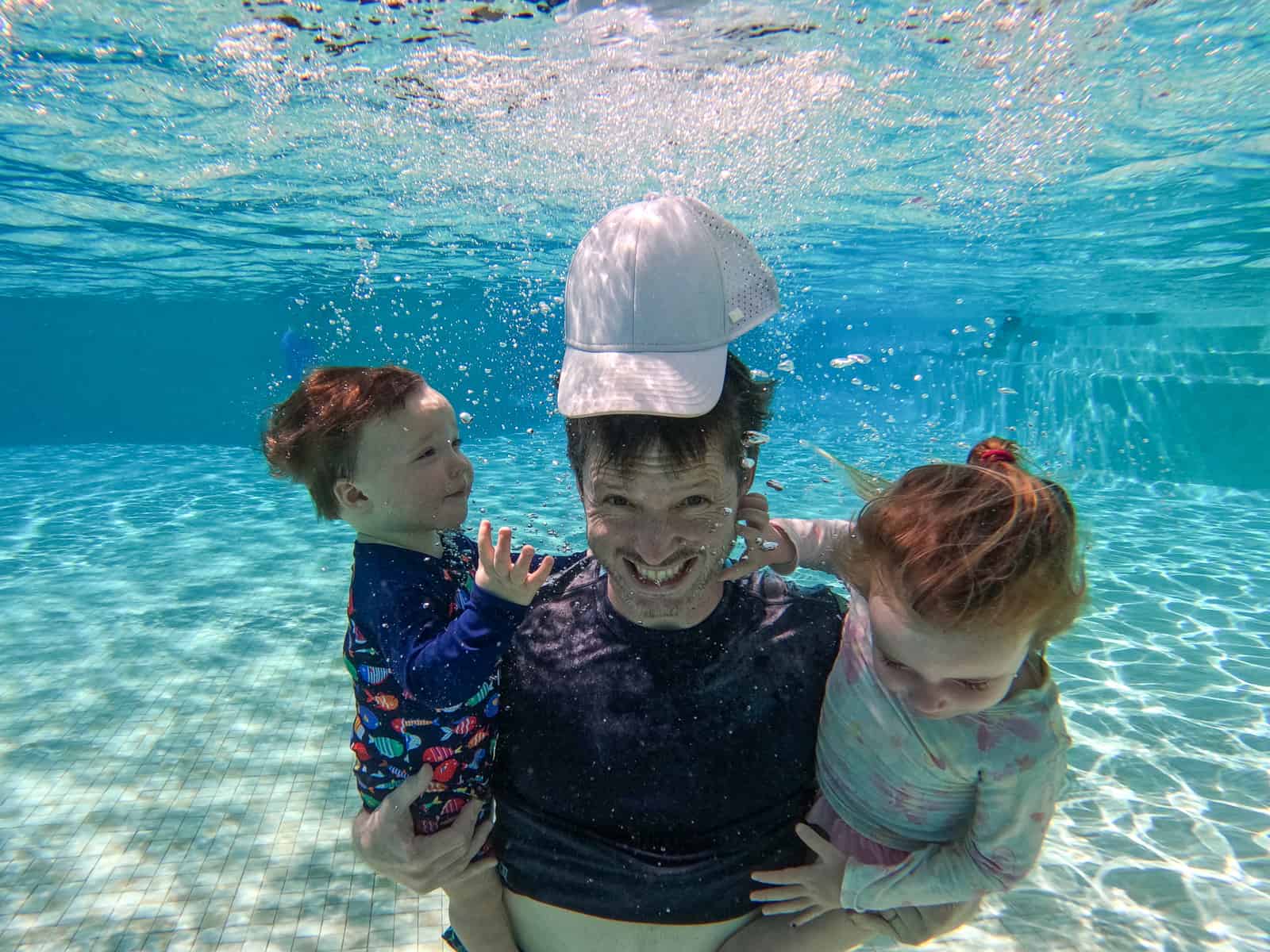 dad and kids underwater rosewood mayakoba luxury family resort