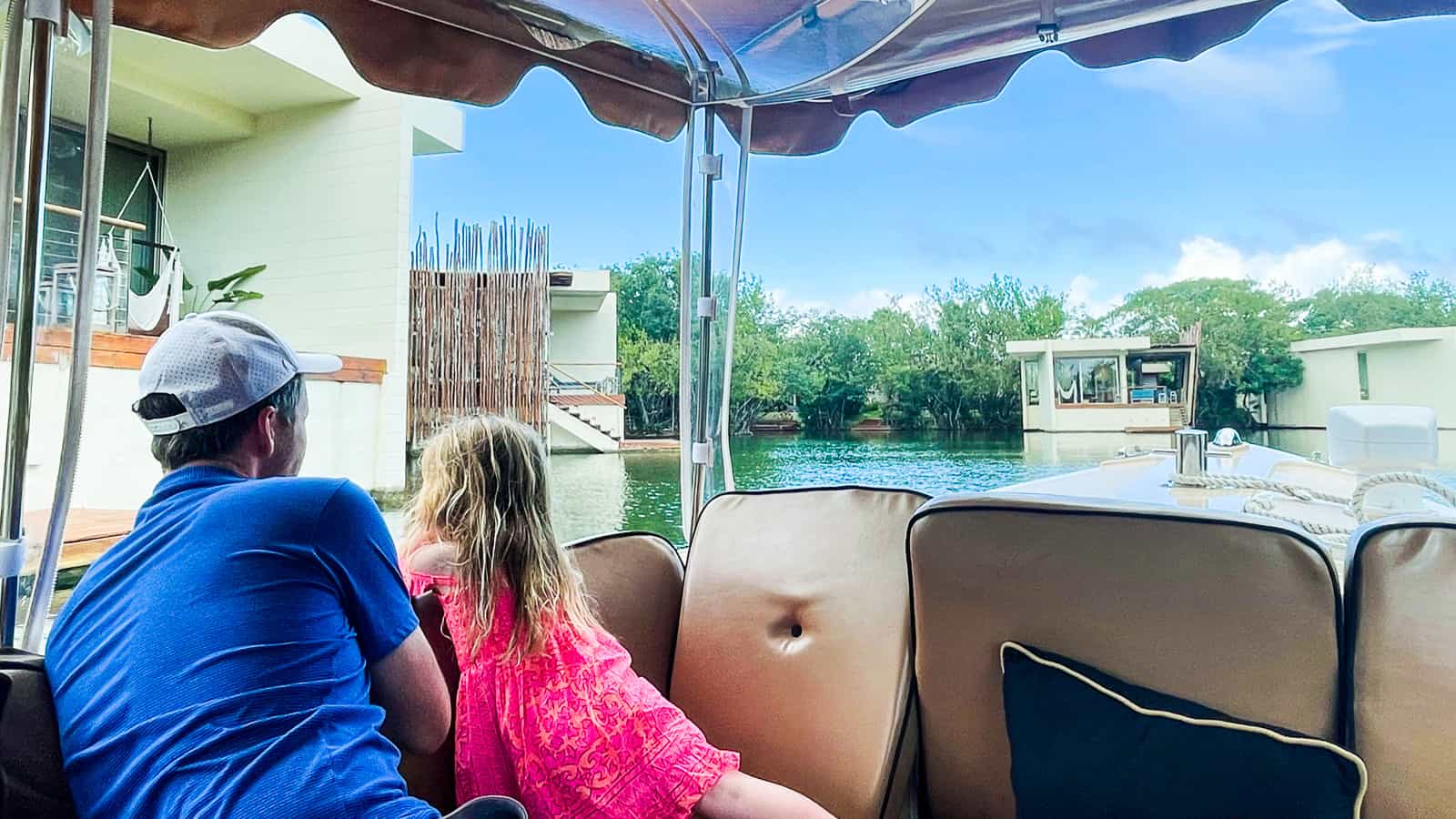 family on Duffy boat - rosewood mayakoba luxury family resort