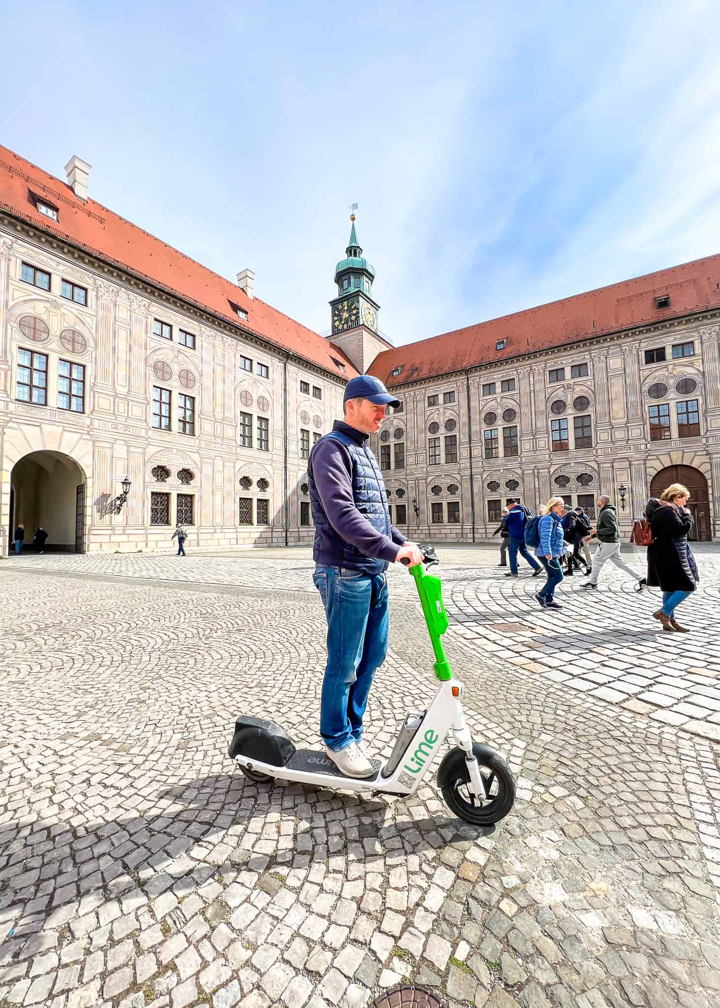 man on scooter - Munich with kids
