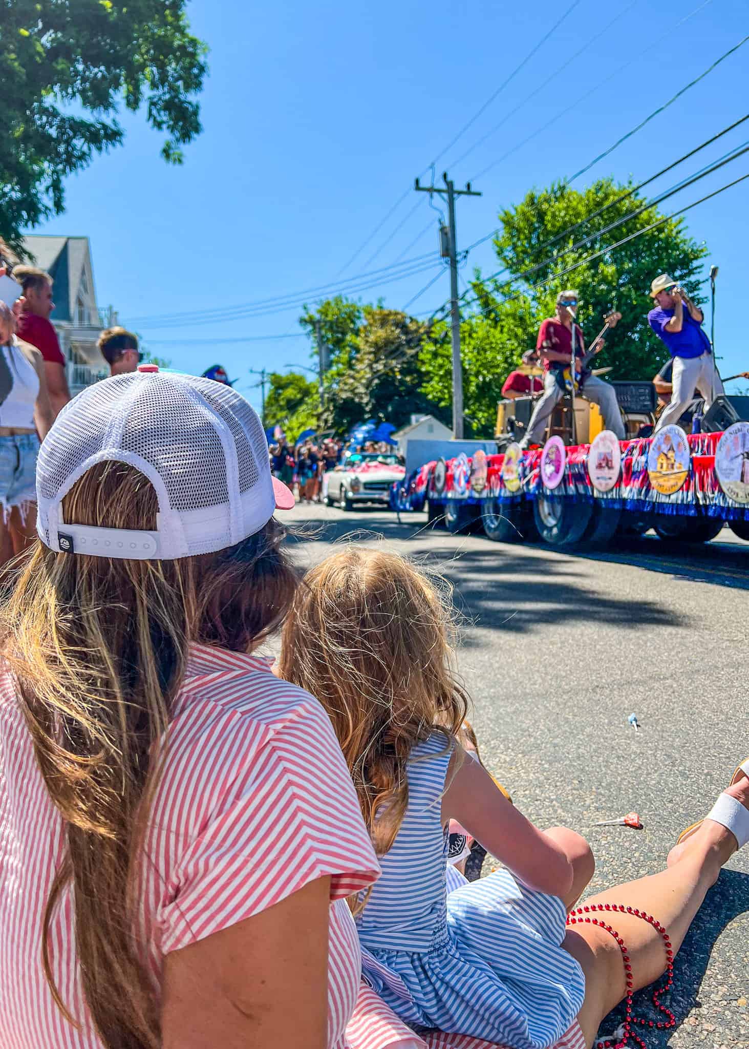 mom and daughter watching parade - cape cod with kids