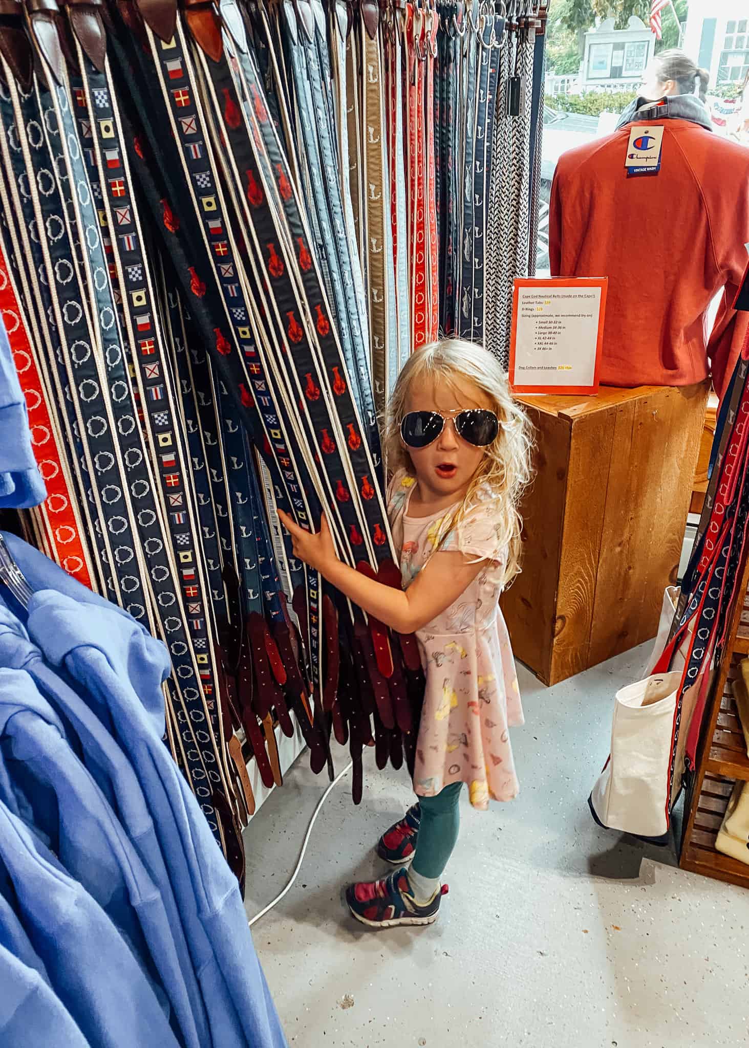 little girl shopping for belts - cape cod with kids