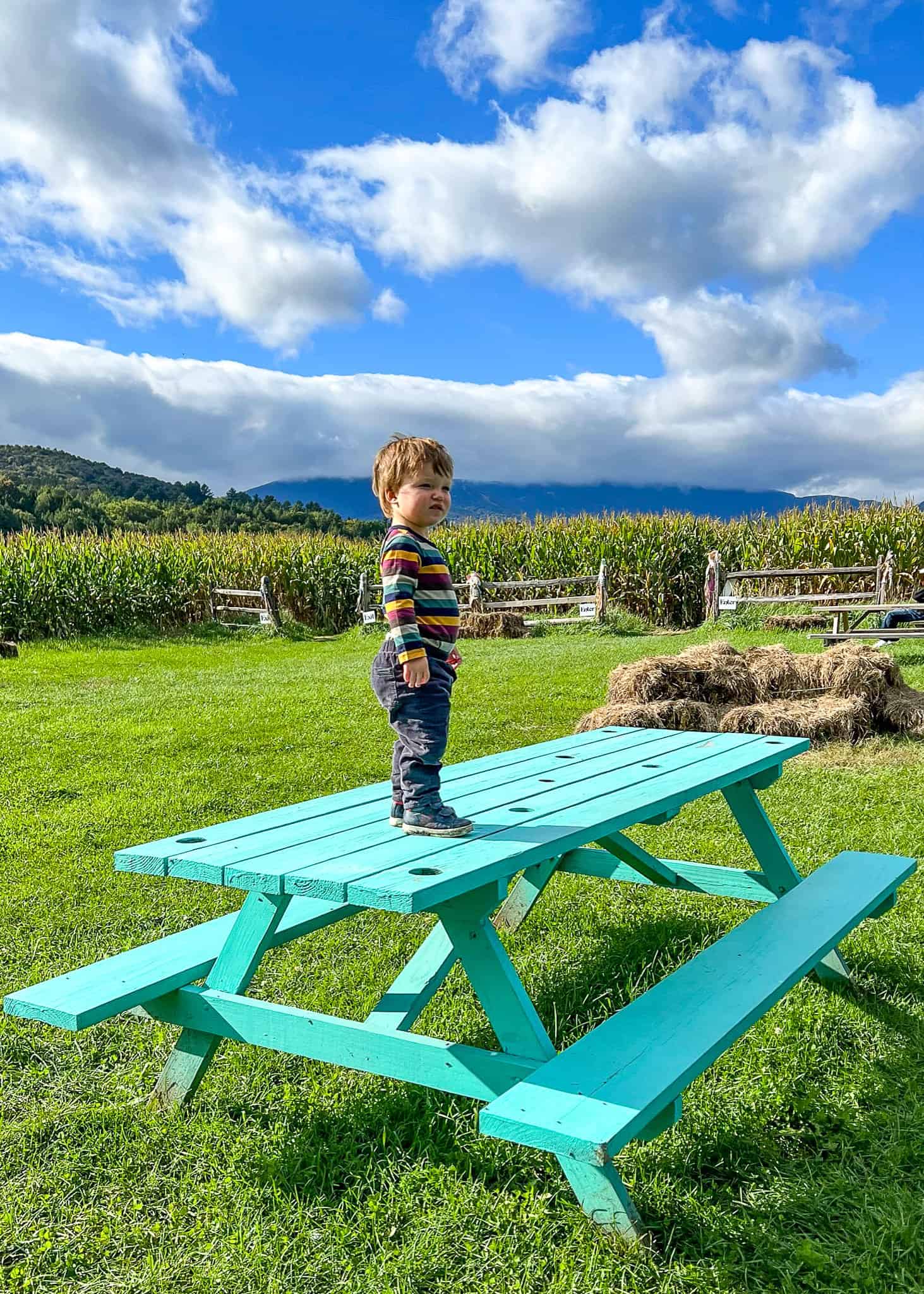 kid on green bench - things to do Stowe vt