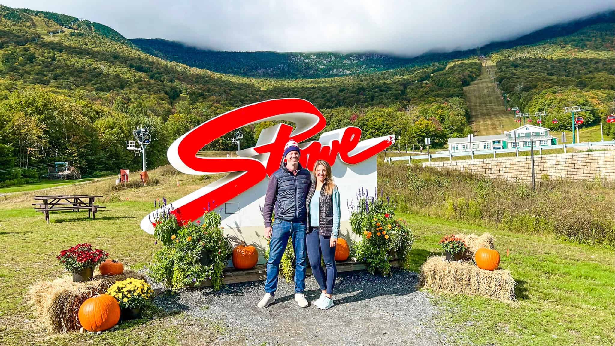 couple in front of Stowe sign vermont