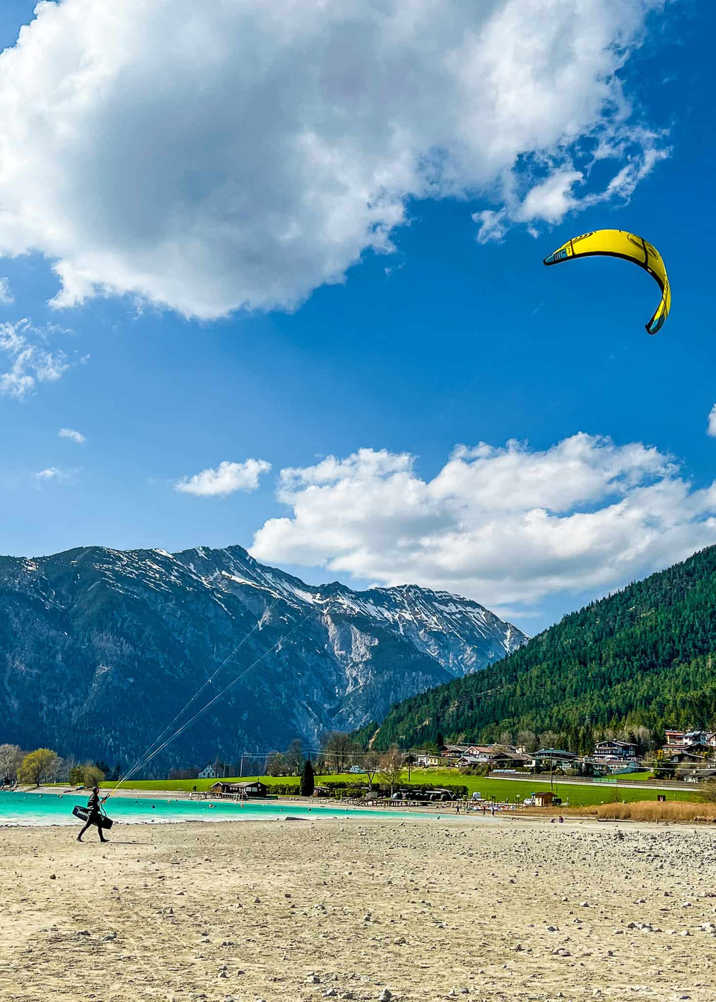 man parasailing lake Achensee- luxury spring break destinations families