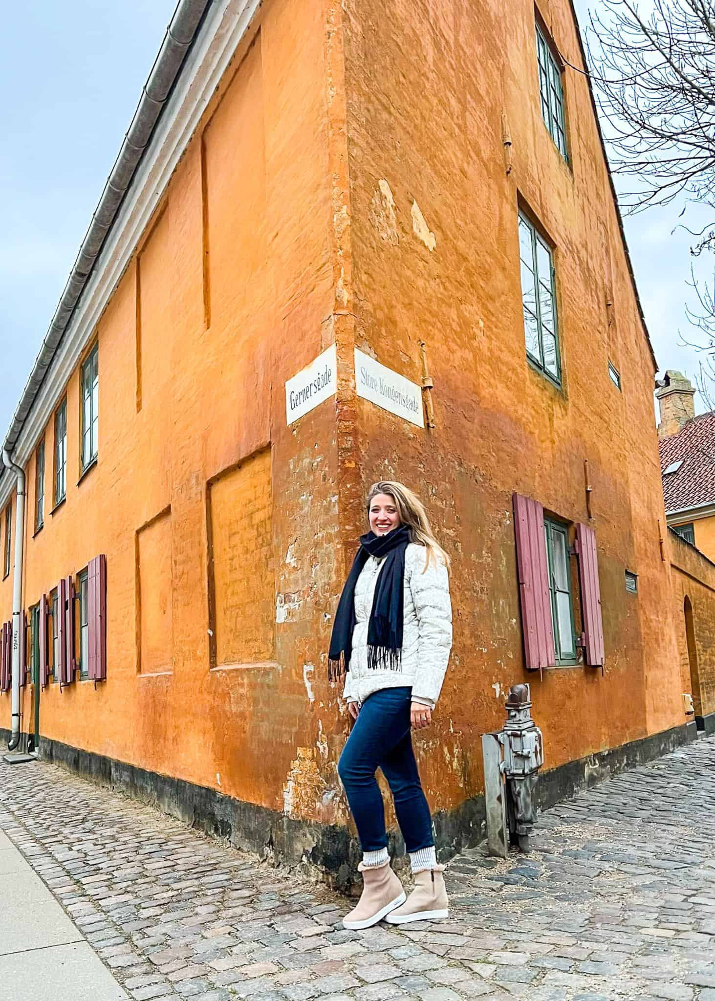 woman standing in front of military housing Copenhagen