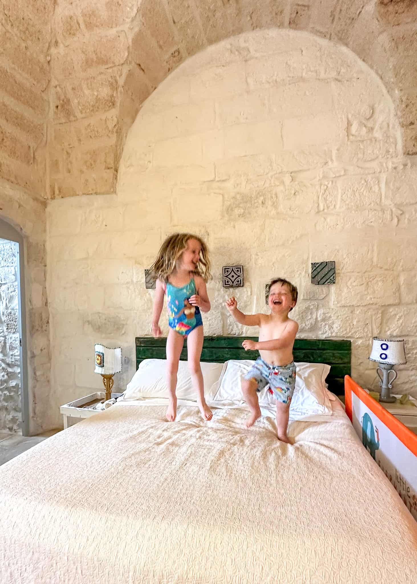 kids jumping on bed masseria cervarolo