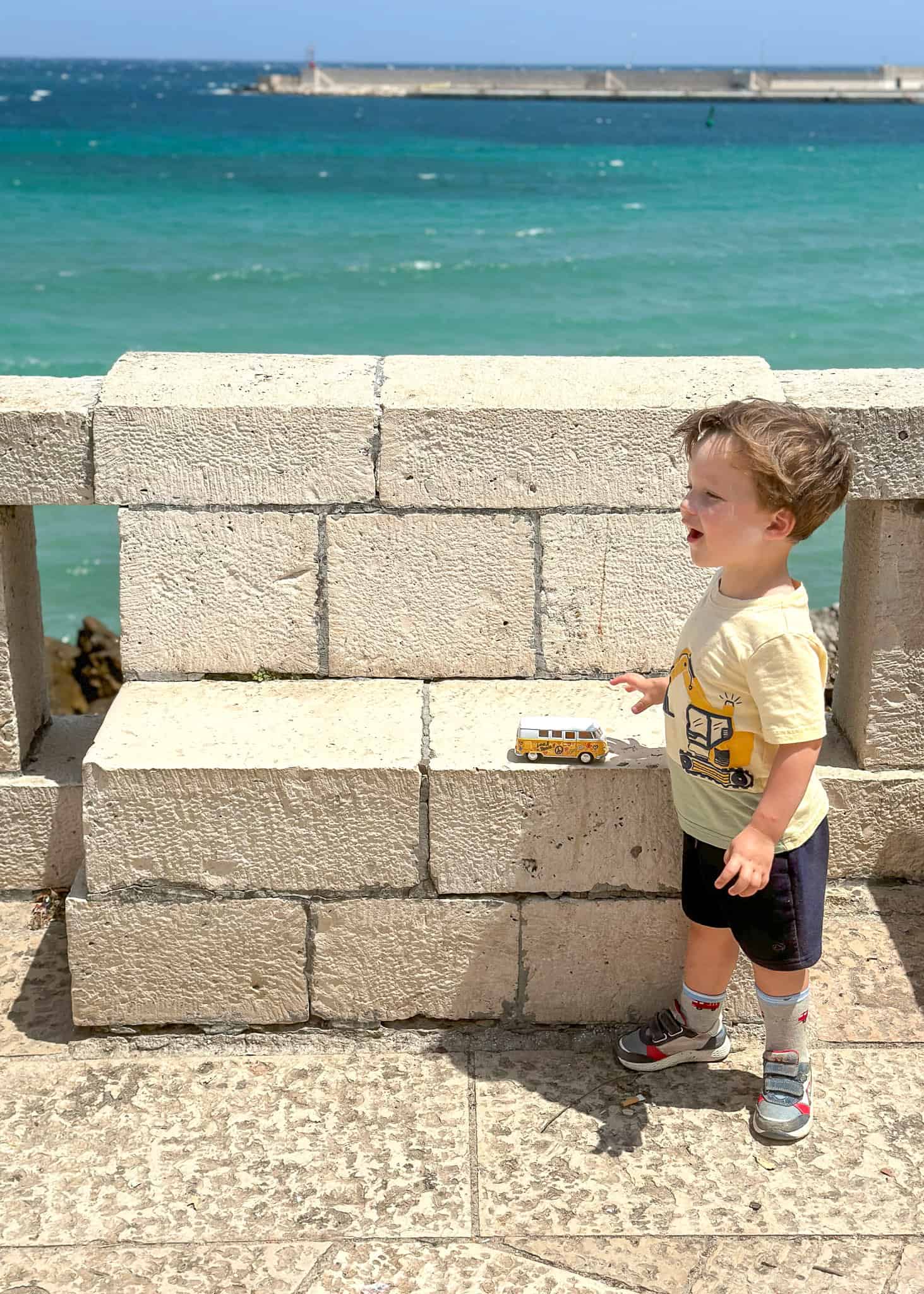 boy playing at otranto with a toy